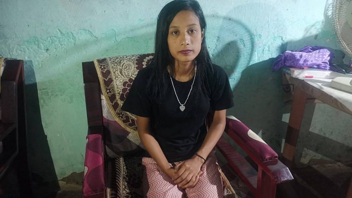 Barshashree Buragohain sits by her study table in her home in Assam | Angana Chakrabarti | ThePrint