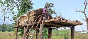 Eklavya founder Raju Kendre sits atop a makeshift wooden hut situated in Melghat, the inspiration behind the organisation's inception | By special arrangement