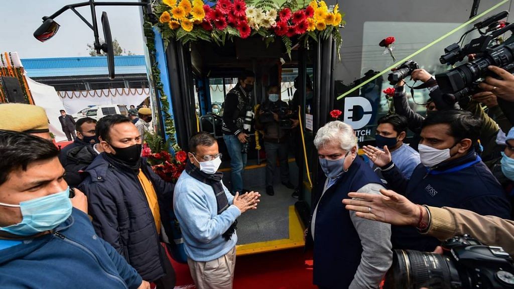 File photo of Delhi chief minister Arvind Kejriwal and transport minister Kailash Gahlot at the launch of Delhi Transport Corporation's first electric bus | PTI