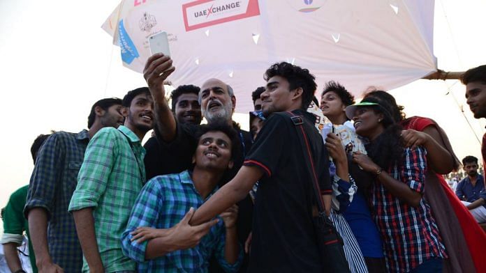 Attendees taking a selfie with journalist and media personality Sashi Kumar at the 2016 Kerala Literature Festival. The young audience often see these events as an opportunity to be 'up close and personal' with their idols. | Photo Credit: Facebook/@keralaliteraturefestival