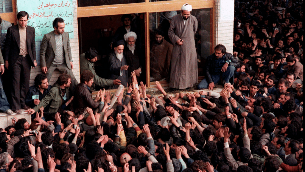 Ruhollah Khomeini (centre) greeting supporters after returning to Tehrān, February 1979 | AP Images