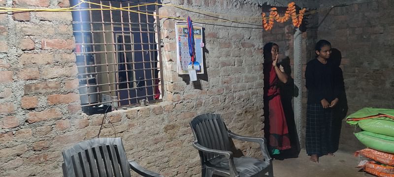 Pooja, 17, stands quietly in a corner with her mother in their dimly lit, one-room shanty with exposed brick walls in Parsodi village near Yavatmal | Nidhima Taneja | ThePrint