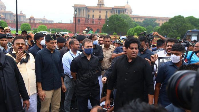 Congress leader Rahul Gandhi, wearing black clothes, with party MPs during a protest march towards Rashtrapati Bhawan, on 5 August 2022 | Photo: Suraj Singh Bisht | ThePrint