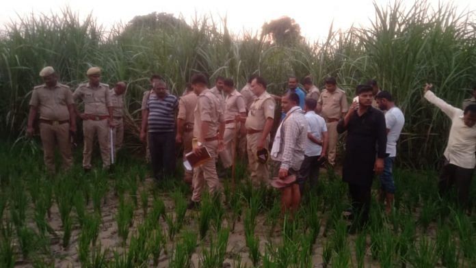 Basti police in the field where the Dalit youth's body was found | By special arrangement