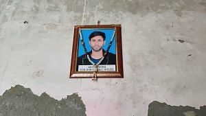  Vishal’s photo hangs on a blank wall in his house in Andha Colony. | Sonal Matharu, ThePrint
