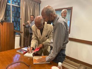 Author K.P. Fabian signing copies of the book | Photo: Gaurvi Narang | ThePrint 
