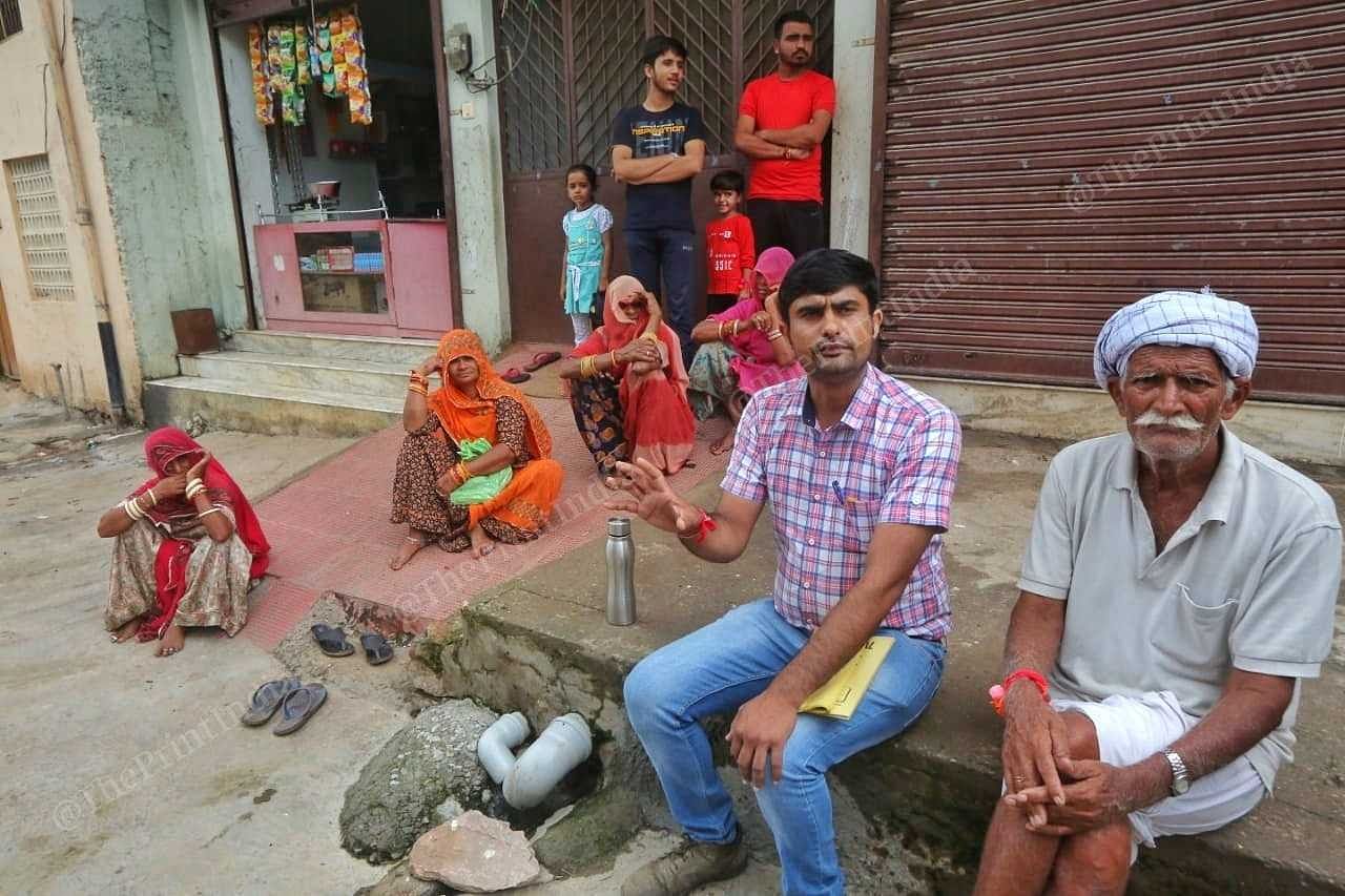 Veterinary officer Dr Subash briefs residents of Sare village about lumpy skin disease, how it spreads among cattle, and what precautions they can take | Praveen Jain | ThePrint
