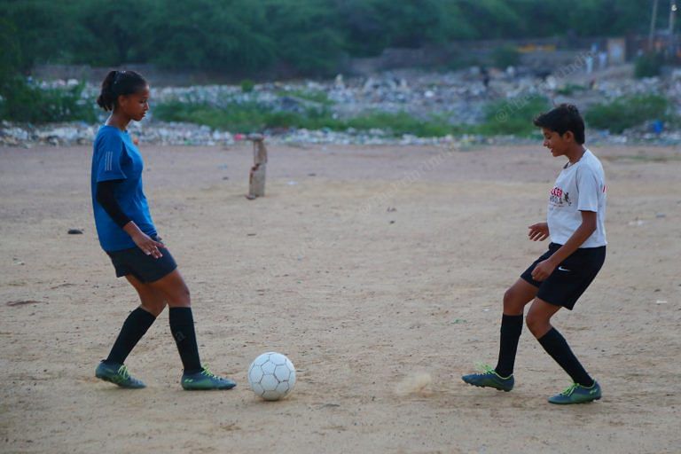 In Delhi’s Sangam Vihar, teenage girls live and dream football. Even if it means taunts