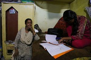 Fouziya's mother supervising her studies. She is a student of class 9 | Manisha Mondal | ThePrint