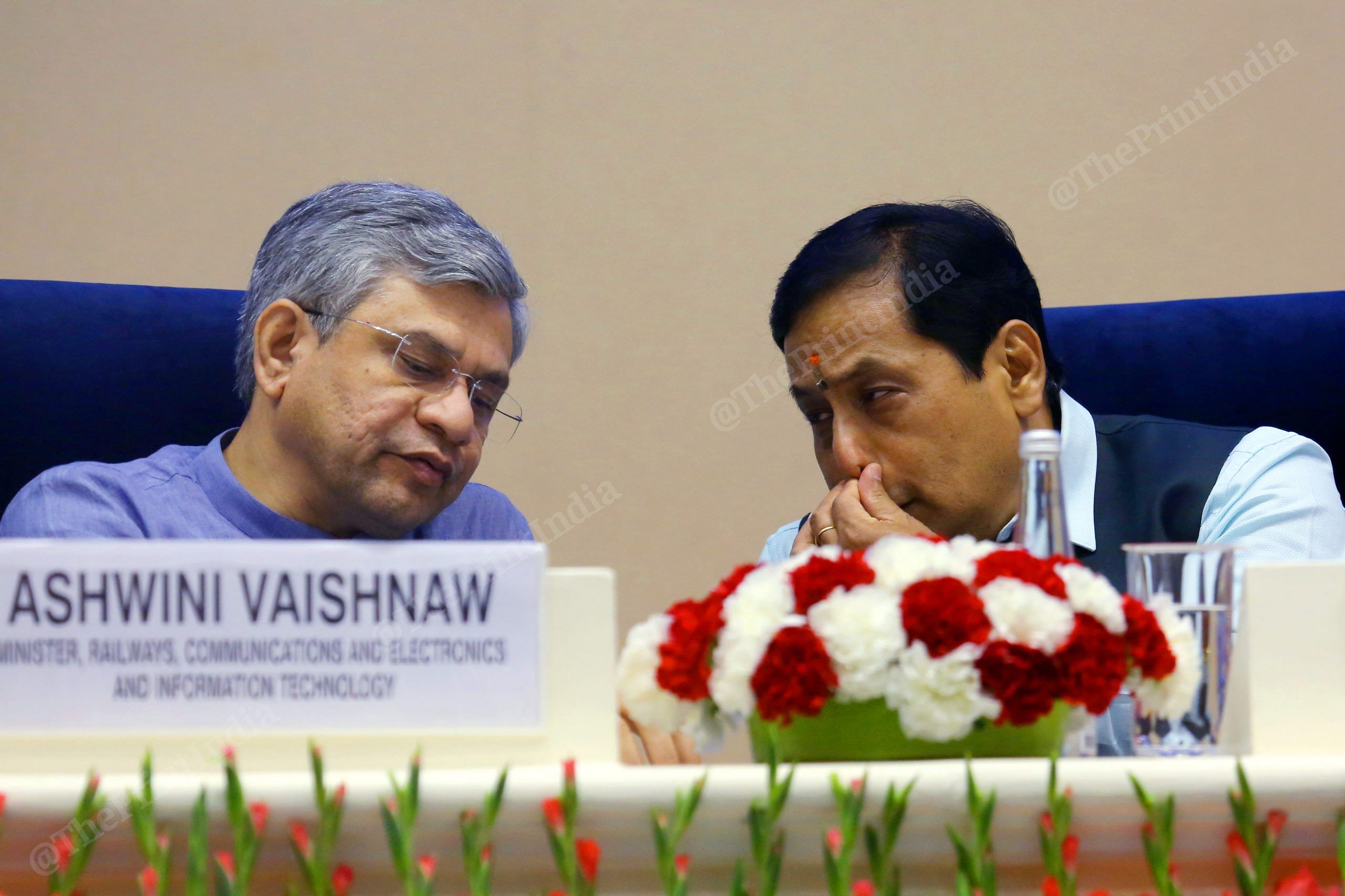 Vaishnaw and Sonowal talk during the event | Photo: Praveen Jain | ThePrint