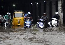 People wading through a flooded road following heavy rainfall in Chennai | ANI file photo