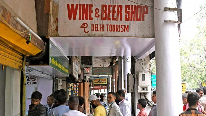 Representational image | People wait in a queue to buy liquor as government-run liquor shops open after Delhi government reverts to old excise policy, in New Delhi on 1 September | ANI Photo