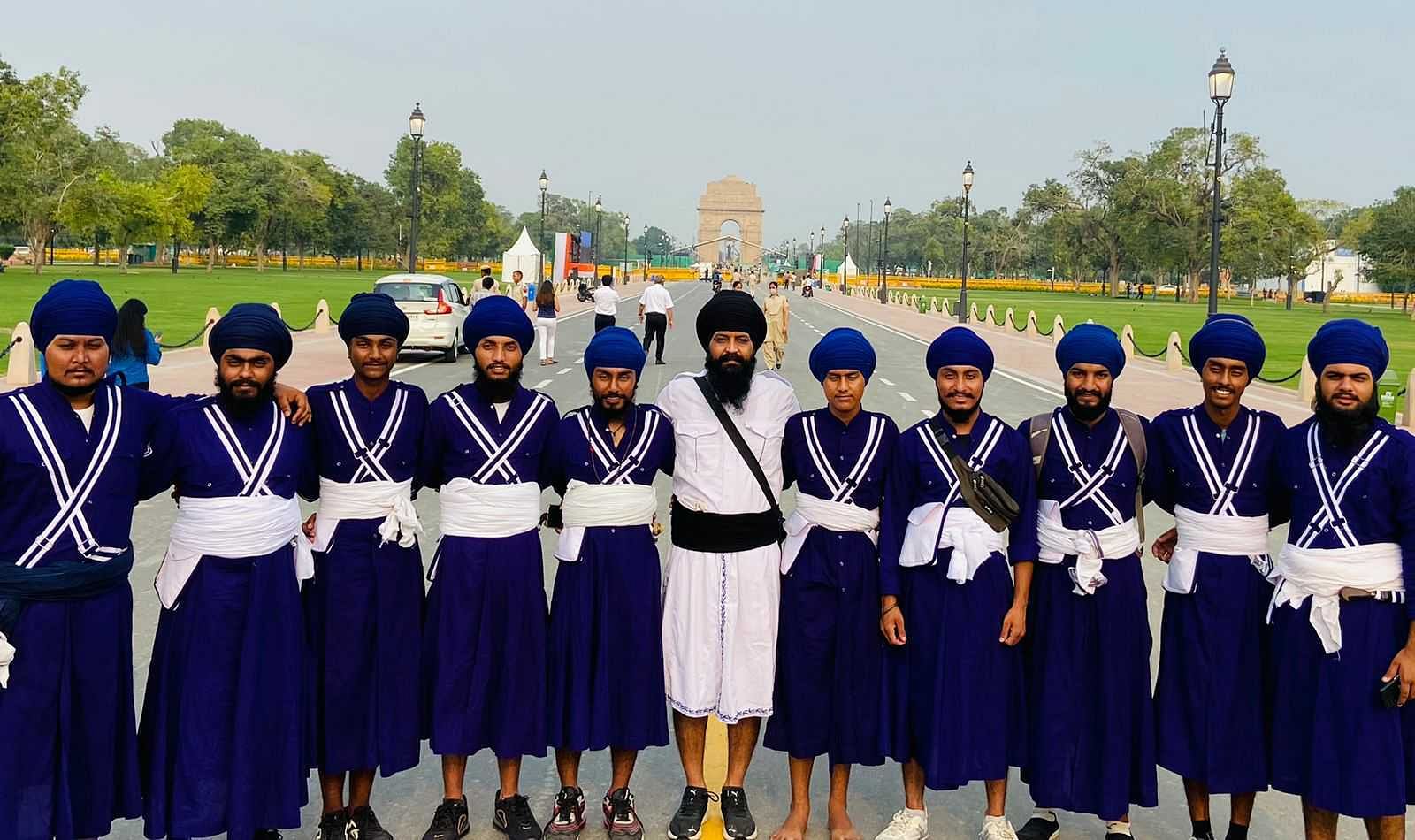 Coach Talwinder Singh (dressed in white) with his cultural team from Punjab | Chitvan Vinayak | ThePrint