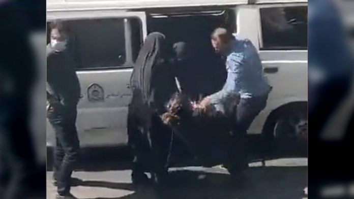 Video grab of a non-hijab wearing woman being detained by the morality police in Iran | Twitter | @AlinejadMasih