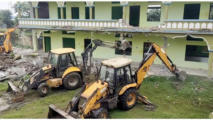 JCB machines during the demolition drive at the madrasa in Bongaigaon on Wednesday | ANI