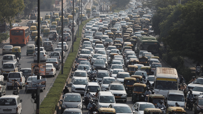 Vehicles queue at a traffic light on a hazy morning in New Delhi on 16 October 2020 | Anushree Fadnavis via Reuters