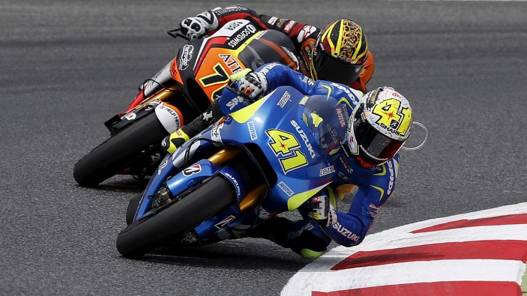 File Photo of Suzuki Moto GP rider Aleix Espargaro take a curve followed by Yamaha Moto GP rider Loris Baz of France during the qualifying session of the Catalunya Grand Prix at the Barcelona-Catalunya circuit, in Montmelo near Barcelona, Spain, 13 June, 2015 | Reuters