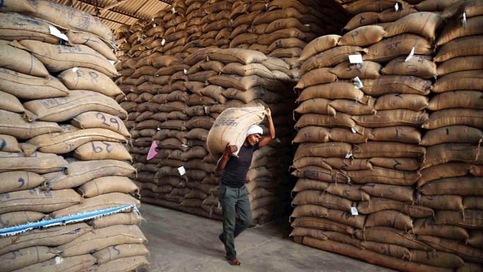 A worker carrying sacks of rice at a government facility | Representational image | ANI