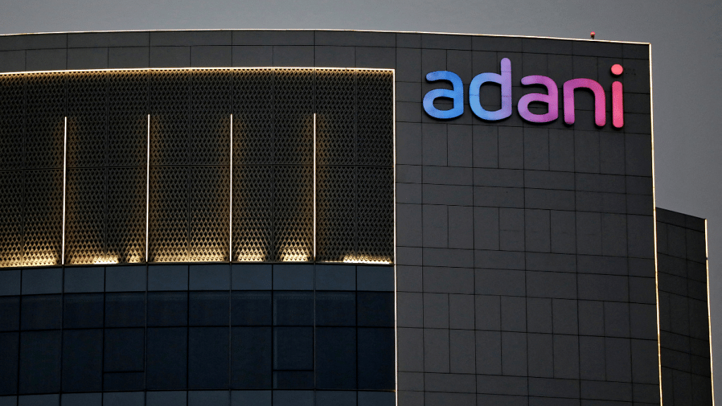 File Photo: The logo of the Adani Group is seen on the facade of one of its buildings on the outskirts of Ahmedabad, India, 13 April, 2021 / Reuters/ Amit Dave