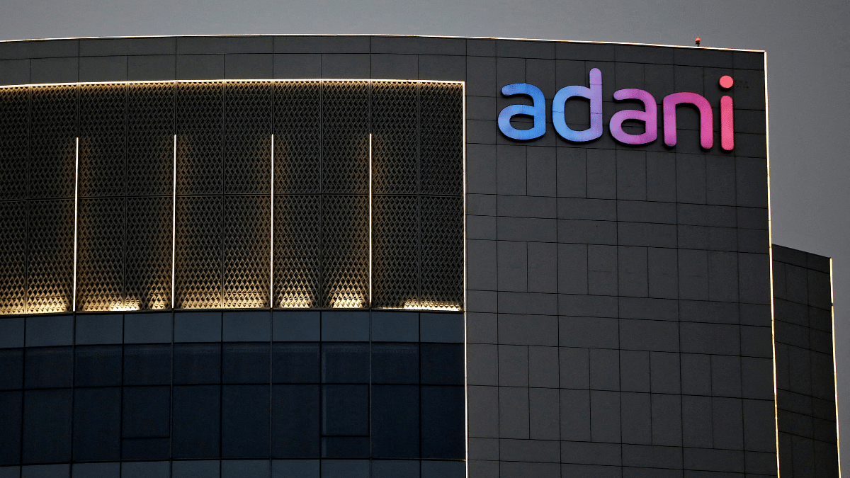 The logo of the Adani Group is seen on the facade of one of its buildings on the outskirts of Ahmedabad | Reuters file photo The logo of the Adani Group is seen on the facade of one of its buildings on the outskirts of Ahmedabad | Reuters file photo