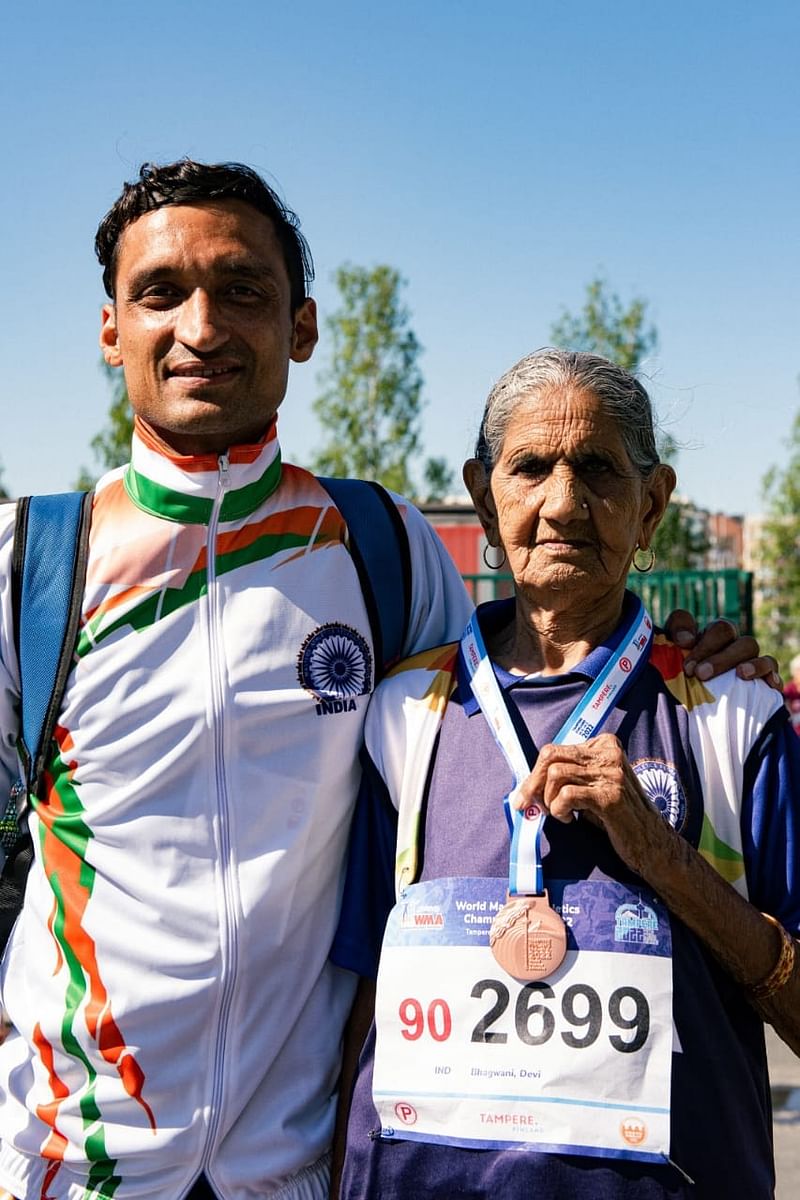 Bhagwani Devi With Her Grandson Vikas Dagar, Who took her to these competitions. 