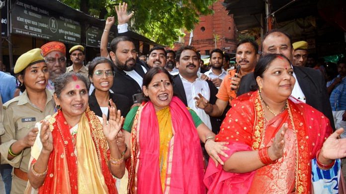 Plaintiffs with their lawyers celebrate after the district court's verdict in the Gyanvapi mosque-Shringar Gauri case, in Varanasi Monday | PTI