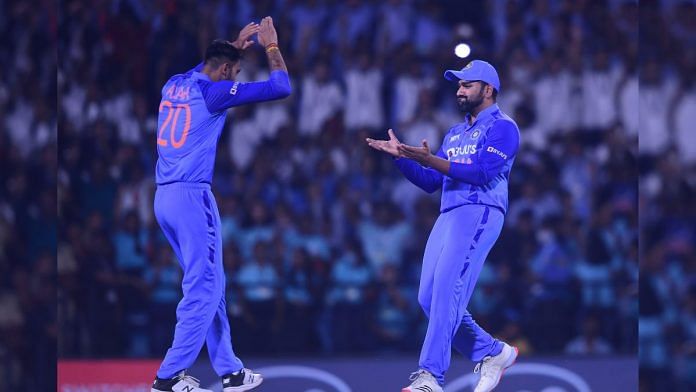 Axar Patel and Rohit Sharma celebrate the wicket of Australian batter Glenn Maxwell during the match between India and Australia, at Vidarbha Cricket Association Stadium in Nagpur, on 23 September 2022 | PTI