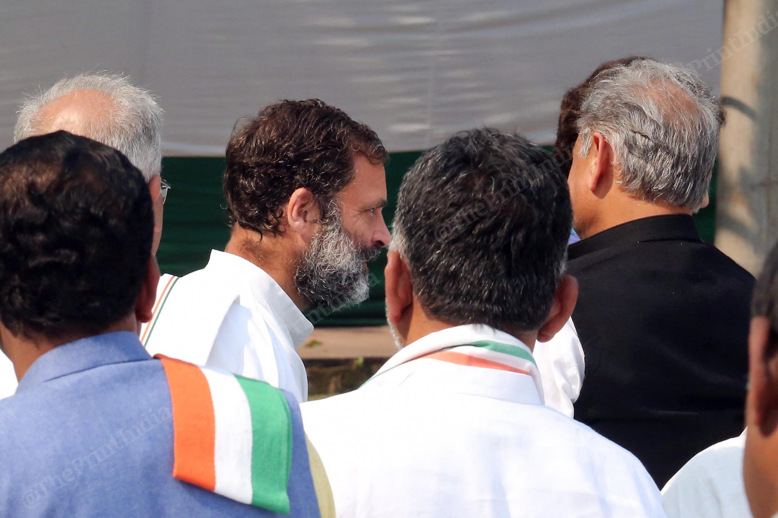 Congress MP Rahul Gandhi passing near Rajasthan CM Ashok Gehlot and Chhattisgarh CM Bhupesh Baghel during a ceremony for presentation of certificate of election to the former, at AICC Headquarters | Praveen Jain | ThePrint