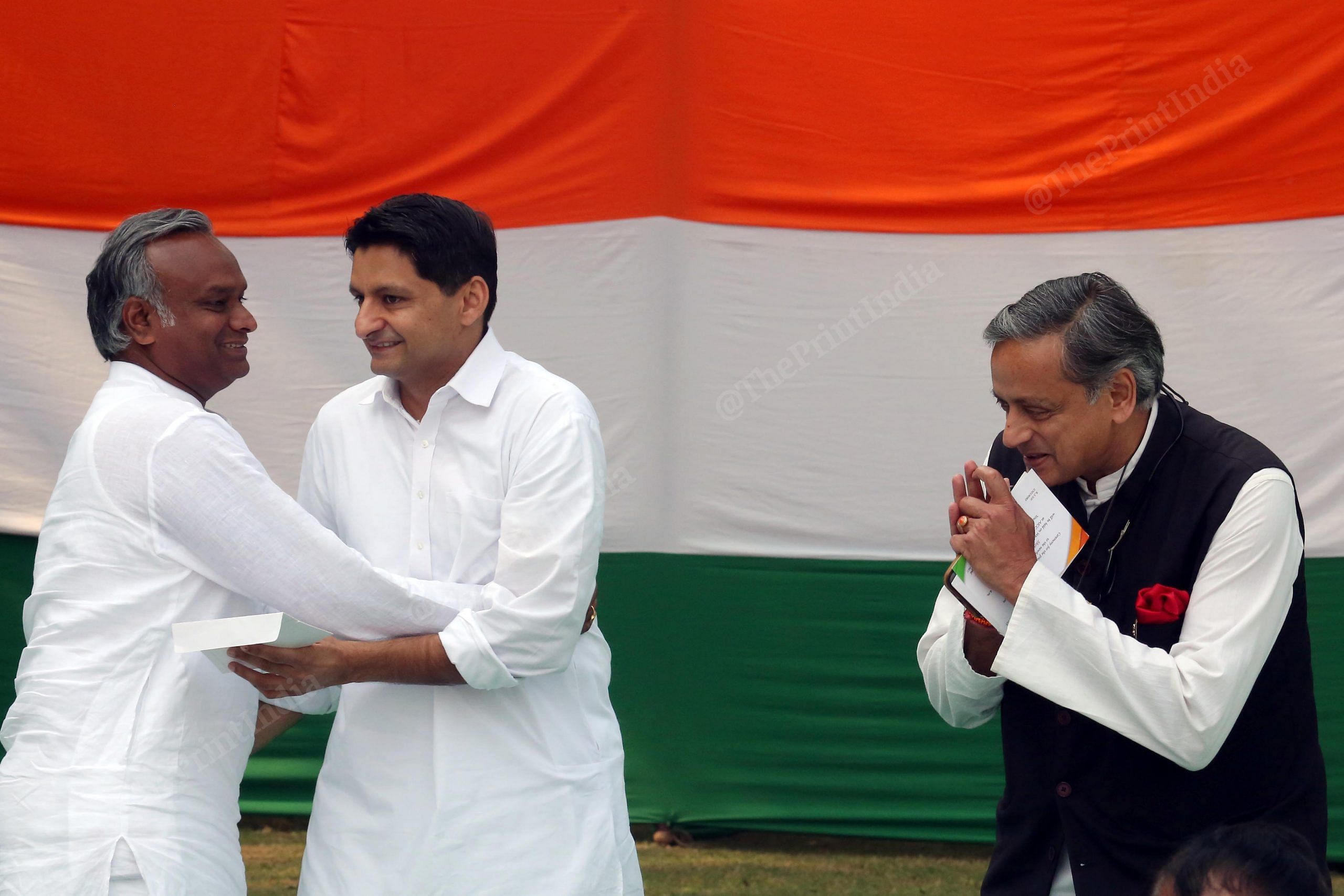 Congress Leader Shashi Tharoor, Deepender Hooda congratulates Mallikarjun kharge son Priyank Kharge during a ceremony for presentation of certificate of election to the former, at AICC Headquarters | Praveen Jain | ThePrint