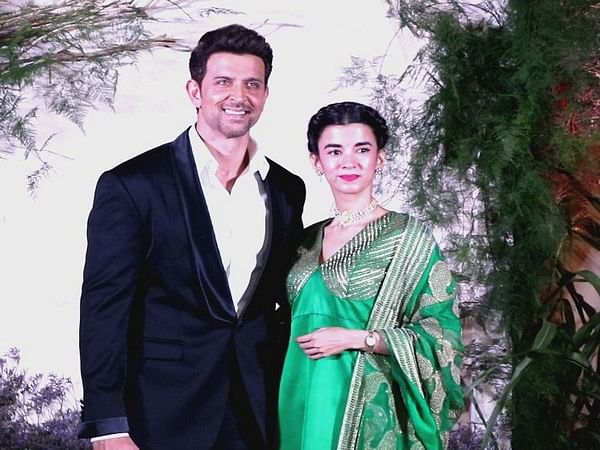 Hrithik Roshan strikes a pose with Saba Azad at RiAli's wedding reception