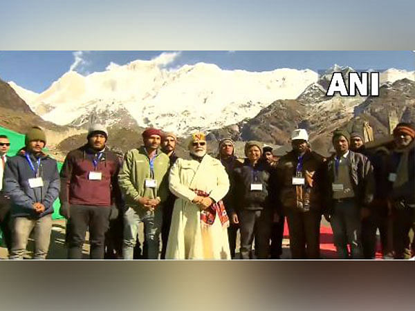 PM Modi interacts with workers engaged in development projects at Kedarnath