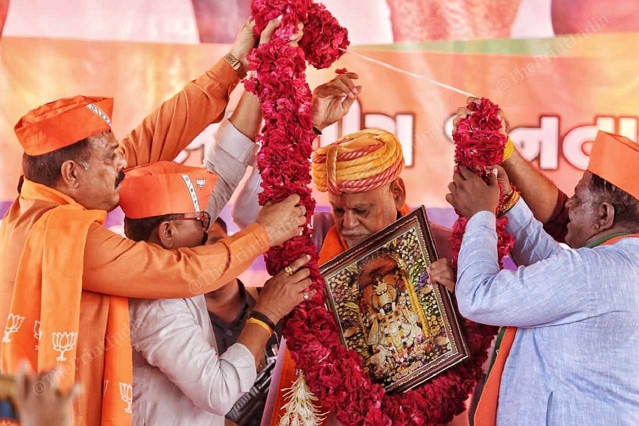 Union minister Purshottam Rupala is welcomed by BJP workers at Gujarat's Talod constituency | Praveen Jain | ThePrint