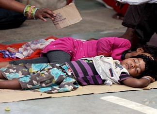 File photo of migrant children resting while waiting for registration of buses during Covid lockdown | ANI