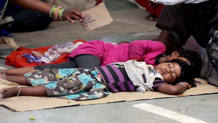 File photo of migrant children resting while waiting for registration of buses during Covid lockdown | ANI