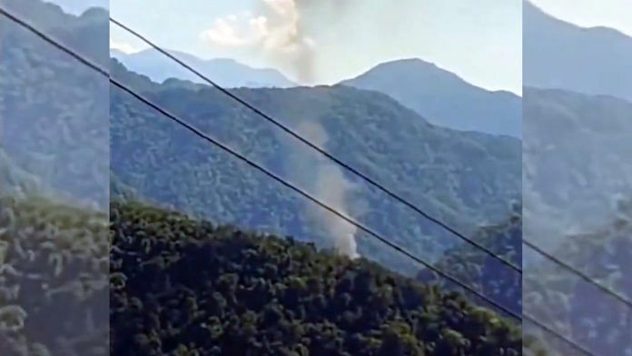 Smoke billows after an advanced light helicopter of the Indian Army crashed at Migging in Upper Siang district of Arunachal Pradesh, on 21 October 2022 | Image via PTI