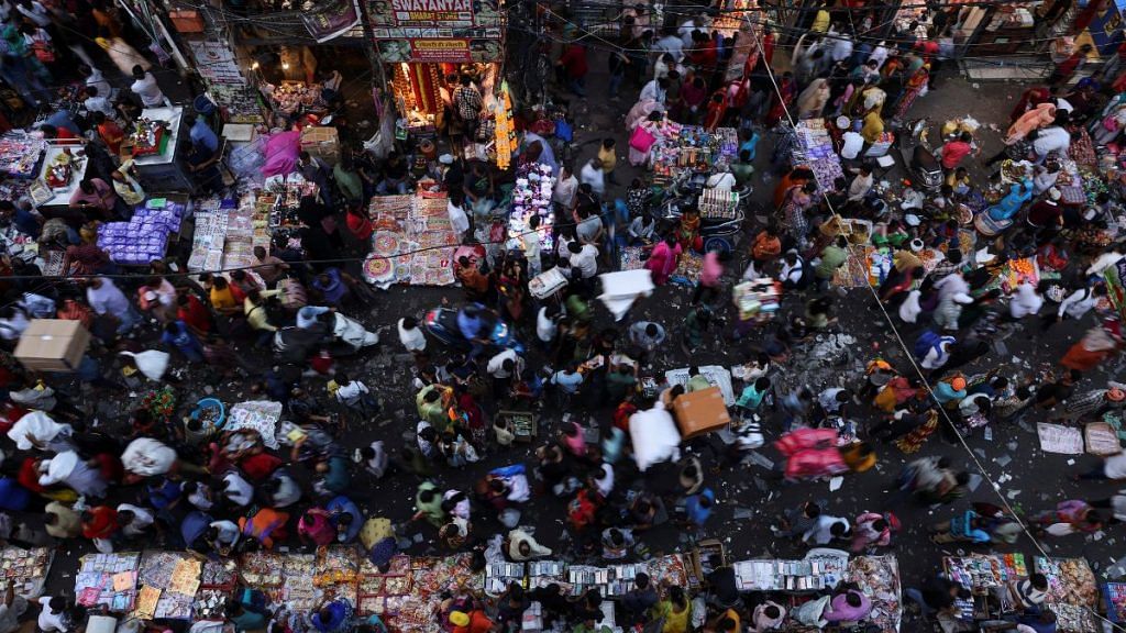 People shop at a crowded market ahead of Diwali, the Hindu festival of lights, in the old quarters of Delhi, India | Reuters/Anushree Fadnavis