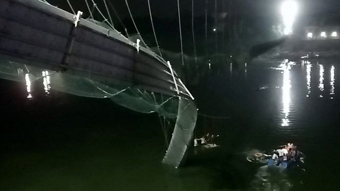 A view shows a damaged part of a suspension bridge after it collapsed in Morbi town in Gujarat 30 October 2022 | Reuters