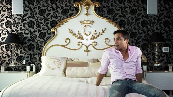 Gurbaksh Chahal poses on his bed monogrammed with gold G| Facebook