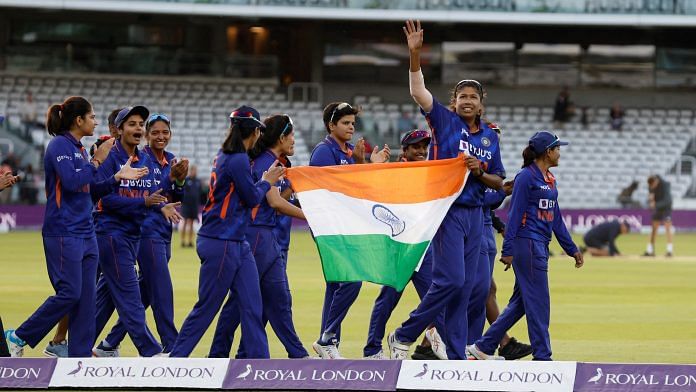 India's Jhulan Goswami and teammates celebrate after winning a game against England