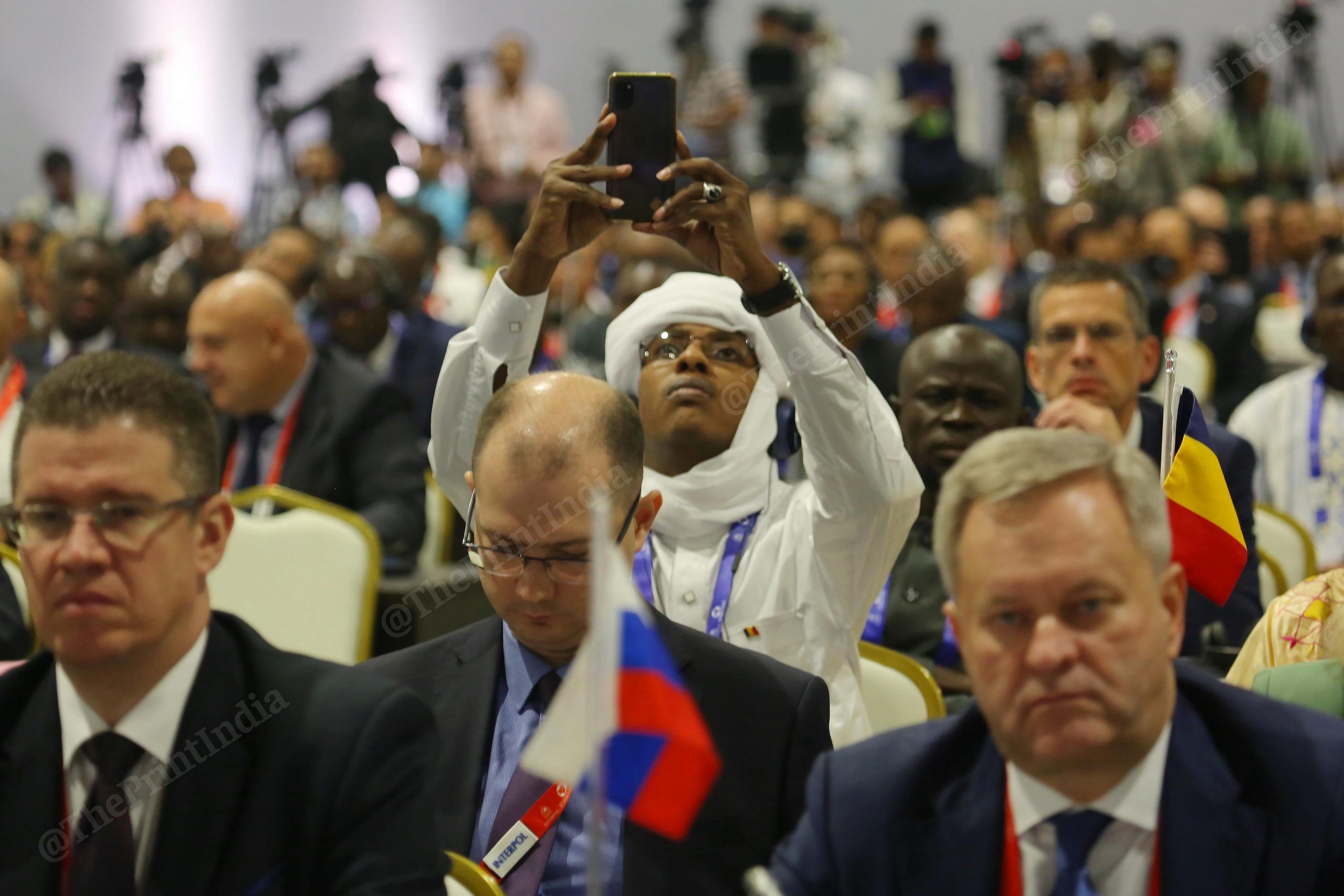 Delegate taking a video of PM speech during the 90th General Assembly of INTERPOL at Pragati Maidan | Photo: Praveen Jain | ThePrint