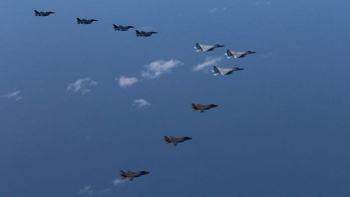 5th and 8th Air Wing of Japan Air Self-Defense Force's F-15 and F-2 fighters hold a joint military drill with U.S. Marine Aircraft Group 12's F-35B fighters off Japan's southernmost main island of Kyushu, Japan on 4 October 2022. | Joint Staff Office of the Defense Ministry of Japan/HANDOUT via Reuters