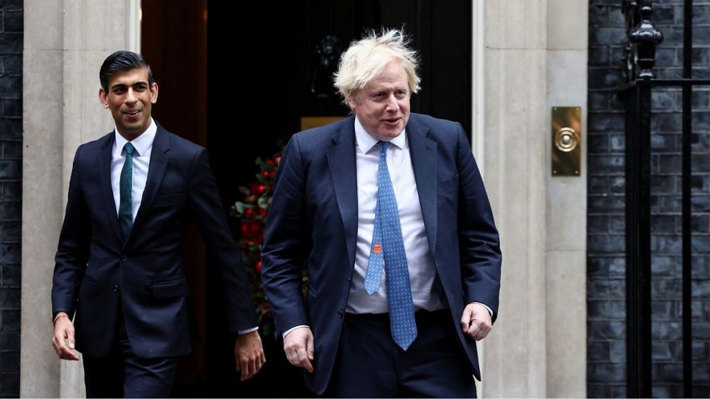 Boris Johnson and Rishi Sunak walk out of Downing Street in London | Reuters file photo