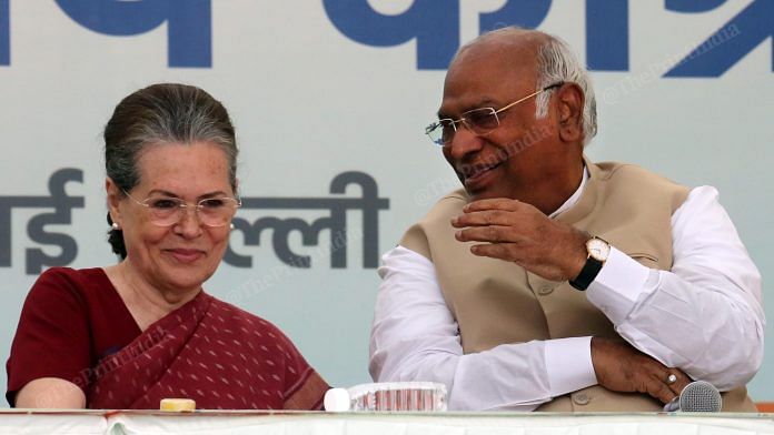 Congress president-elect Mallikarjun Kharge interacts with former party president Sonia Gandhi at a ceremony to appoint a new Congress president at the All India Congress Committee headquarters in New Delhi | Praveen Jain | ThePrint