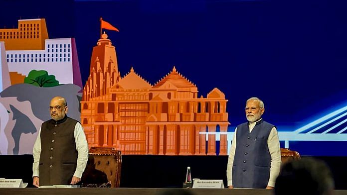 Prime Minister Narendra Modi with Union Home Minister Amit Shah during the 90th General Assembly of Interpol at Pragati Maidan in New Delhi, on 18 October 2022 | PTI