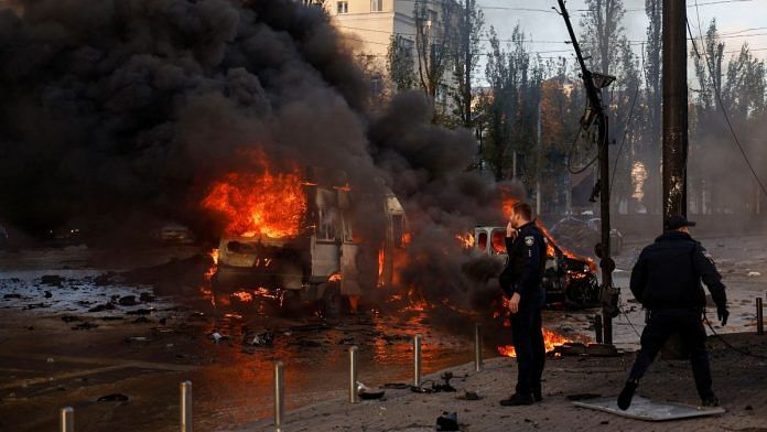 Cars are seen on fire after Russian missile strikes, as Russia's attack continues, in Kyiv, Ukraine | Reuters