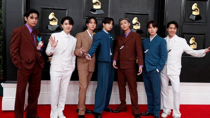 File photo of BTS posing on the red carpet as they attend the 64th Annual Grammy Awards | Reuters