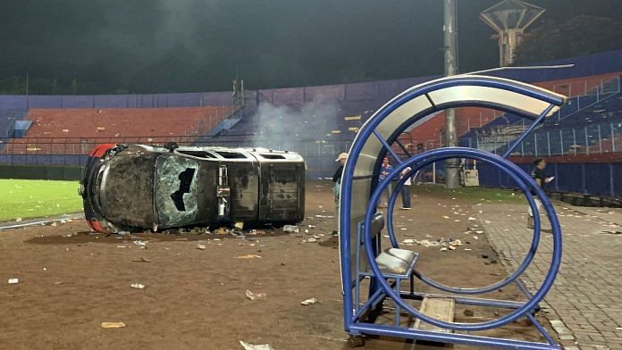 A damaged car is pictured following a riot after the league BRI Liga 1 football match between Arema vs Persebaya at Kanjuruhan Stadium, Malang, East Java province, Indonesia, October 2, 2022 | Reuters