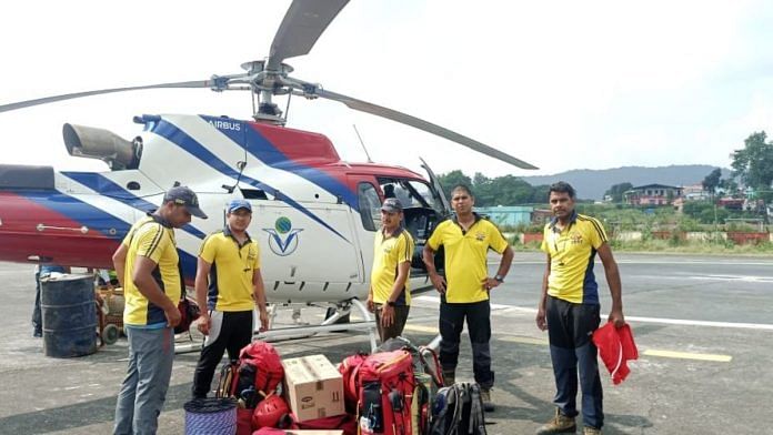SDRF teams leave from Sahastradhara helipad in Dehradun to rescue the trainees trapped in an avalanche in Draupadi's Danda-2 mountain peak | Twitter/@ANINewsUP