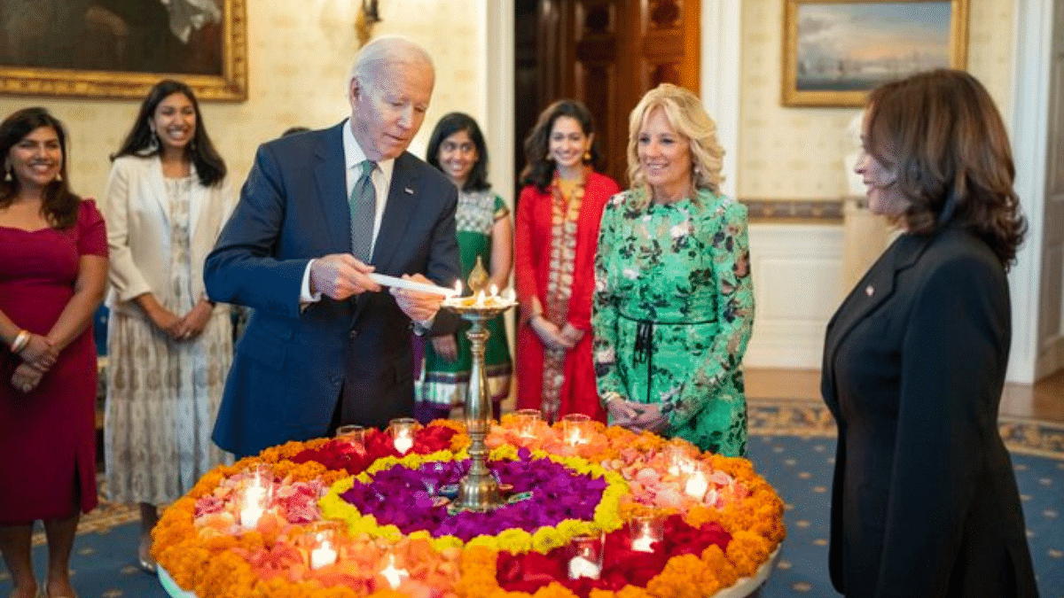 Joe Biden lighting a lamp at the White House | Image via Twitter/@POTUS