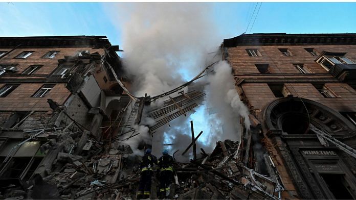 Rescuers work at a residential building which was heavily damaged by a Russian missile strike, amid Russia's attack on Ukraine, in Zaporizhzhia, Ukraine 6 October, 2022 |Reuters